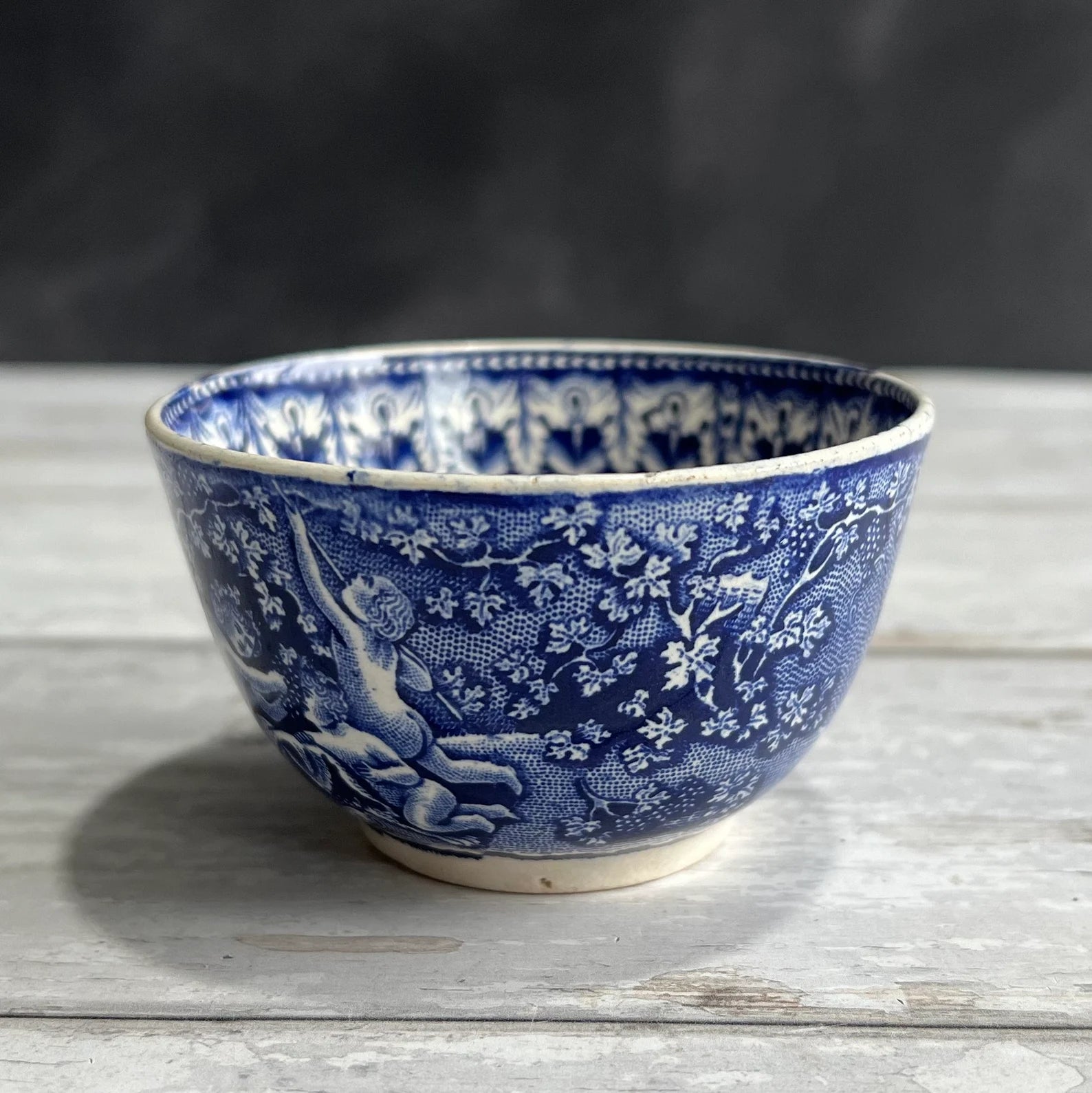 19th Century Transferware Tea Bowl And Saucer Bacchanalian Cherubs Scene Blue And White C 1815