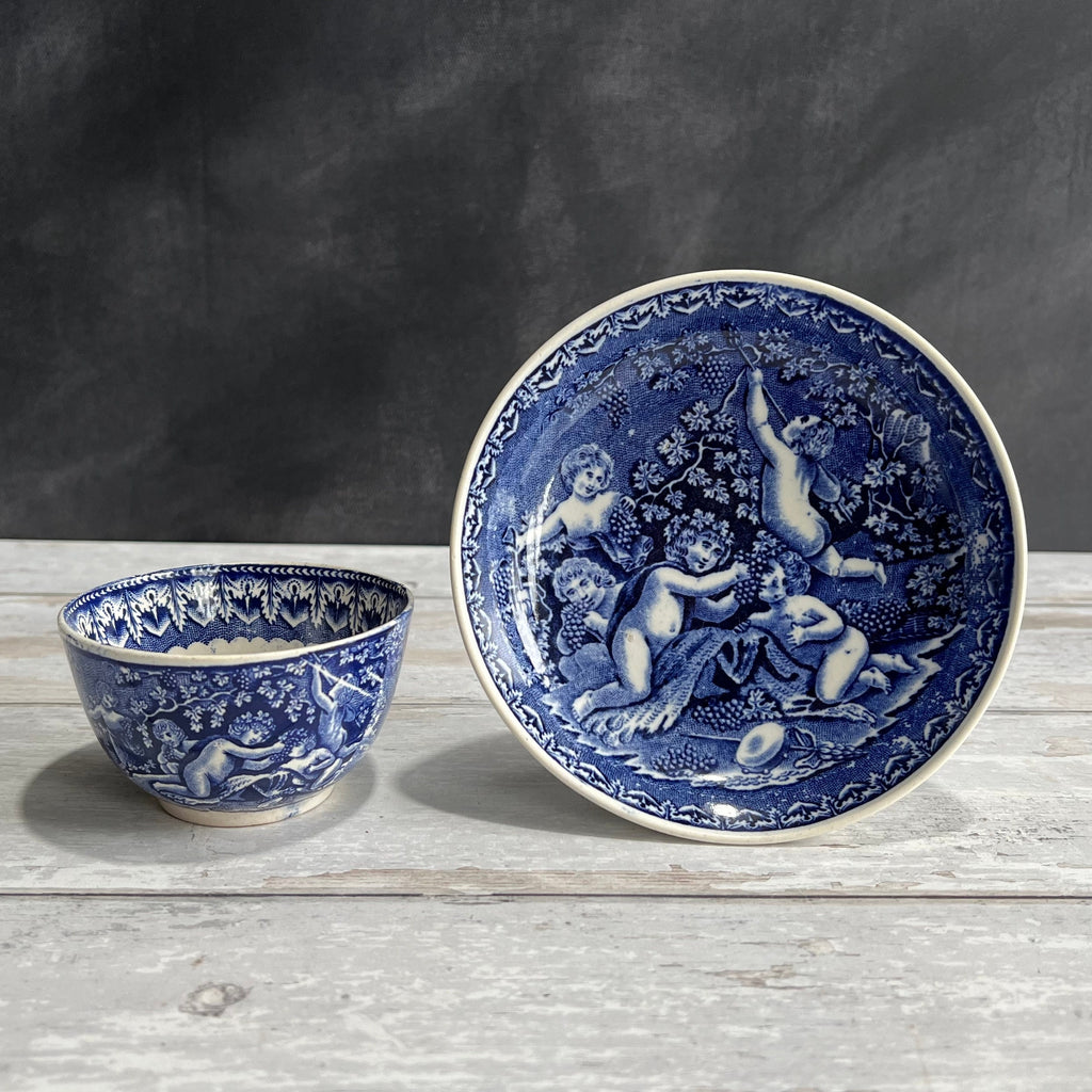 19th Century Transferware Tea Bowl And Saucer Bacchanalian Cherubs Scene Blue And White C 1815