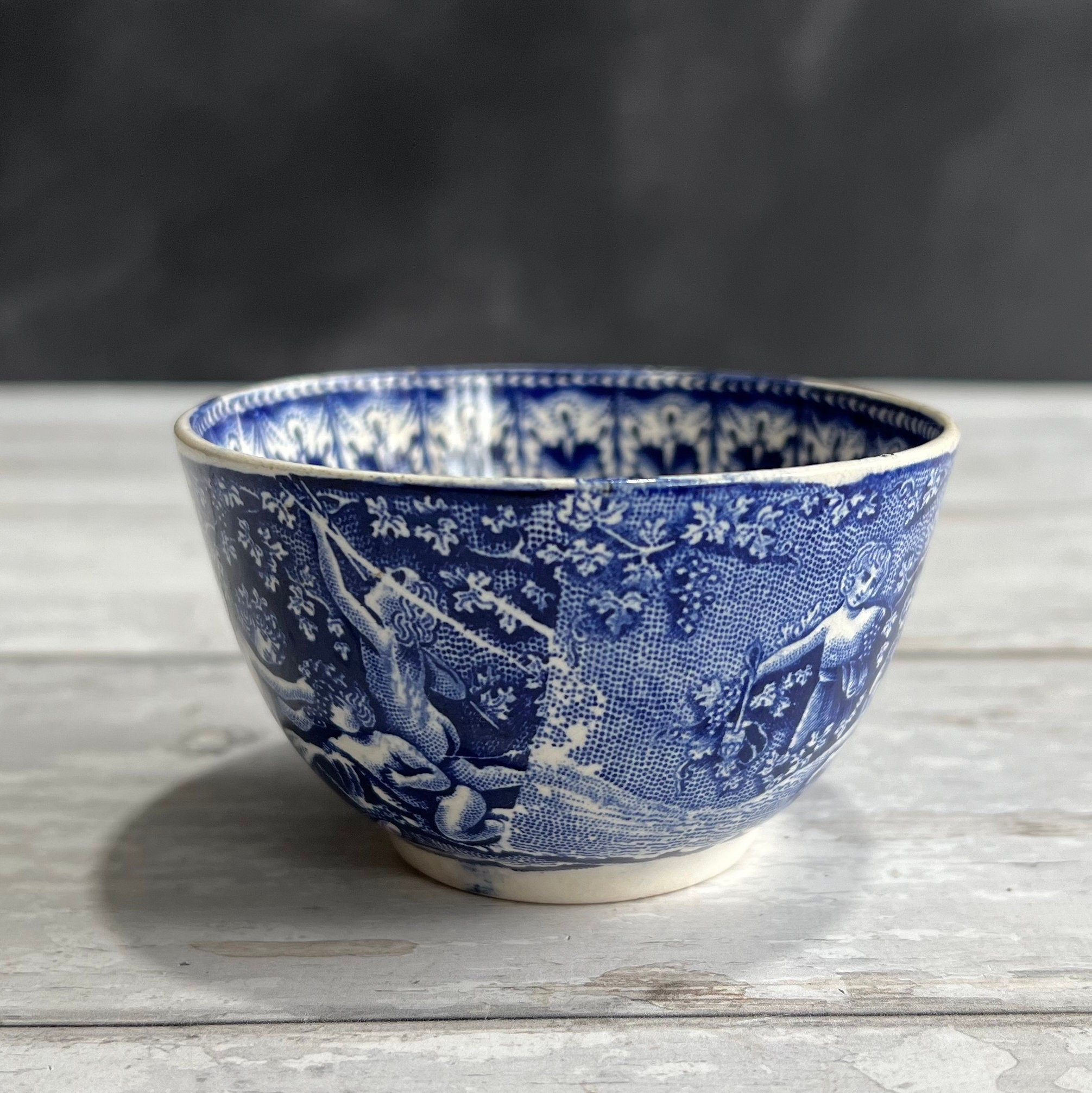 19th Century Transferware Tea Bowl And Saucer Bacchanalian Cherubs Scene Blue And White C 1815